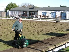 Bob cuts the top off Green 1 with a turf cutter..jpg
